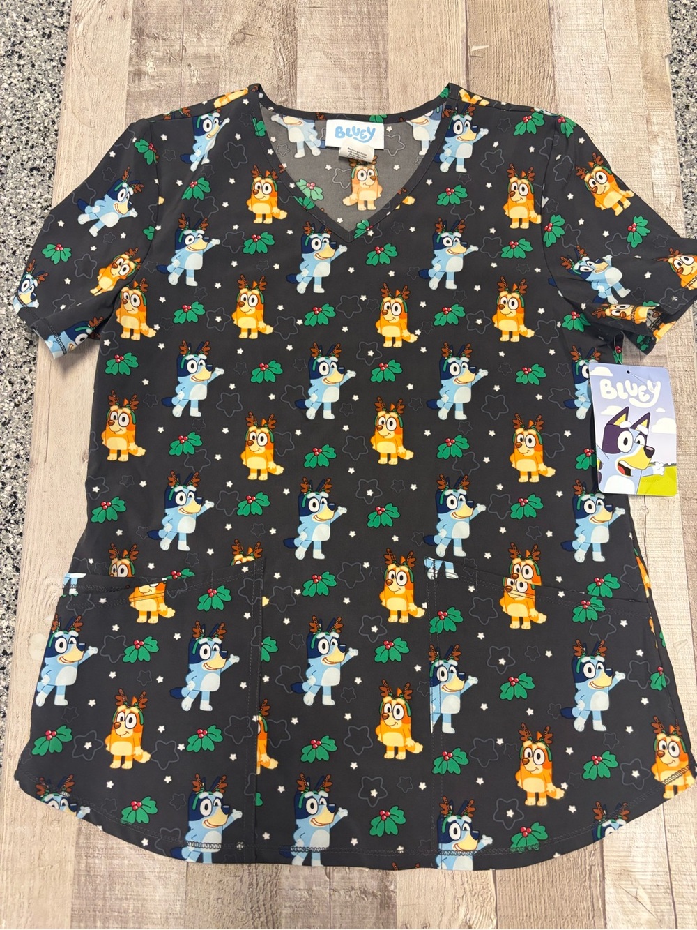 Bluey holiday Scrub Top - Black with Blue & Orange Character Print